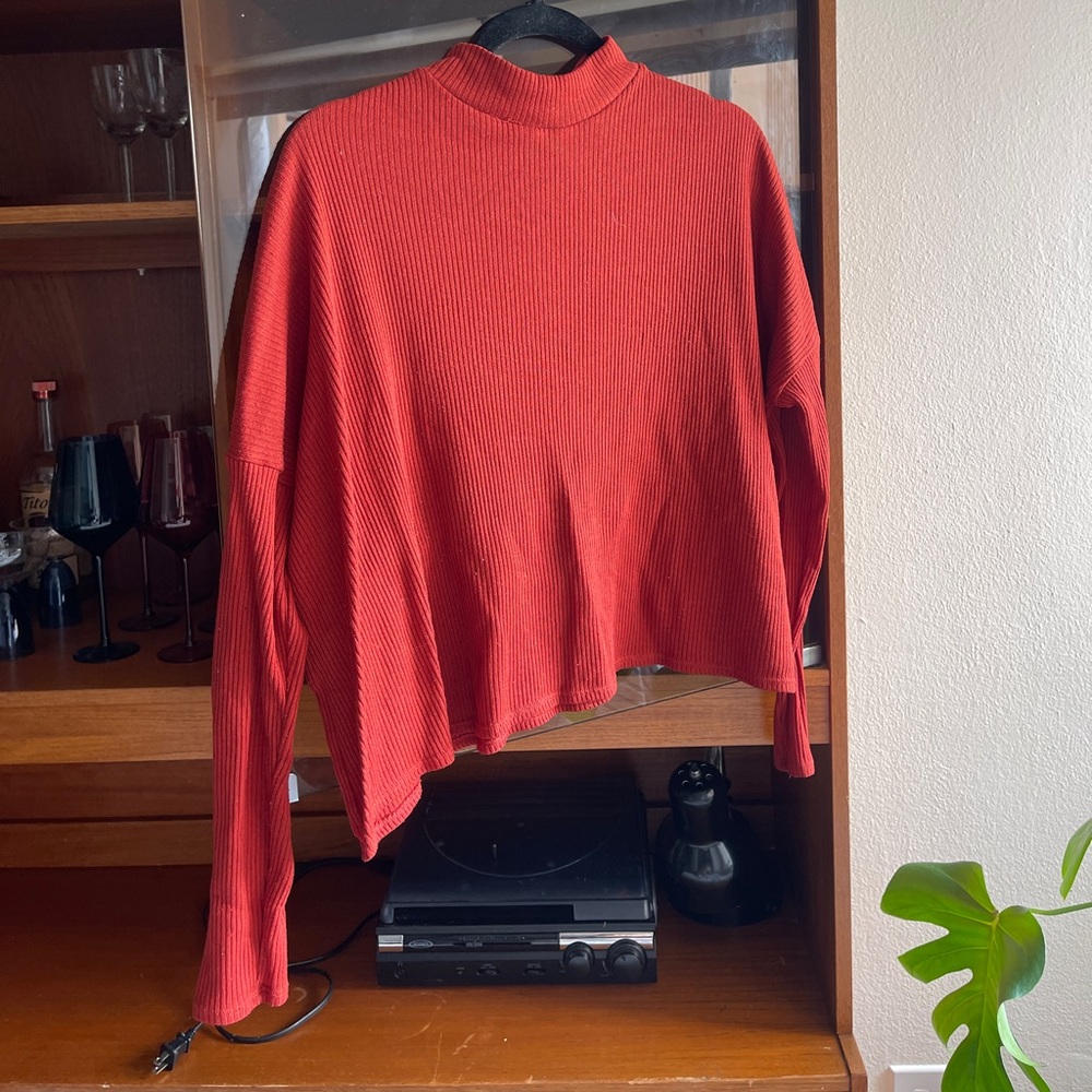 reddish orange mock neck long sleeve top